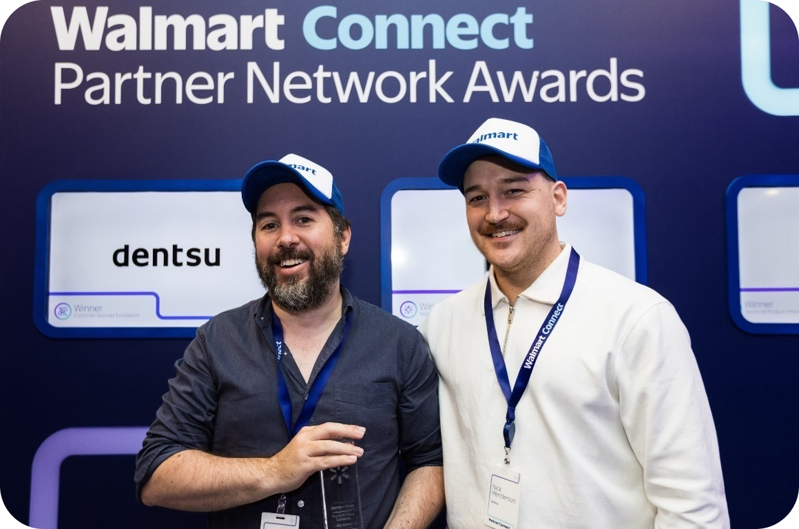 Two men holding an award